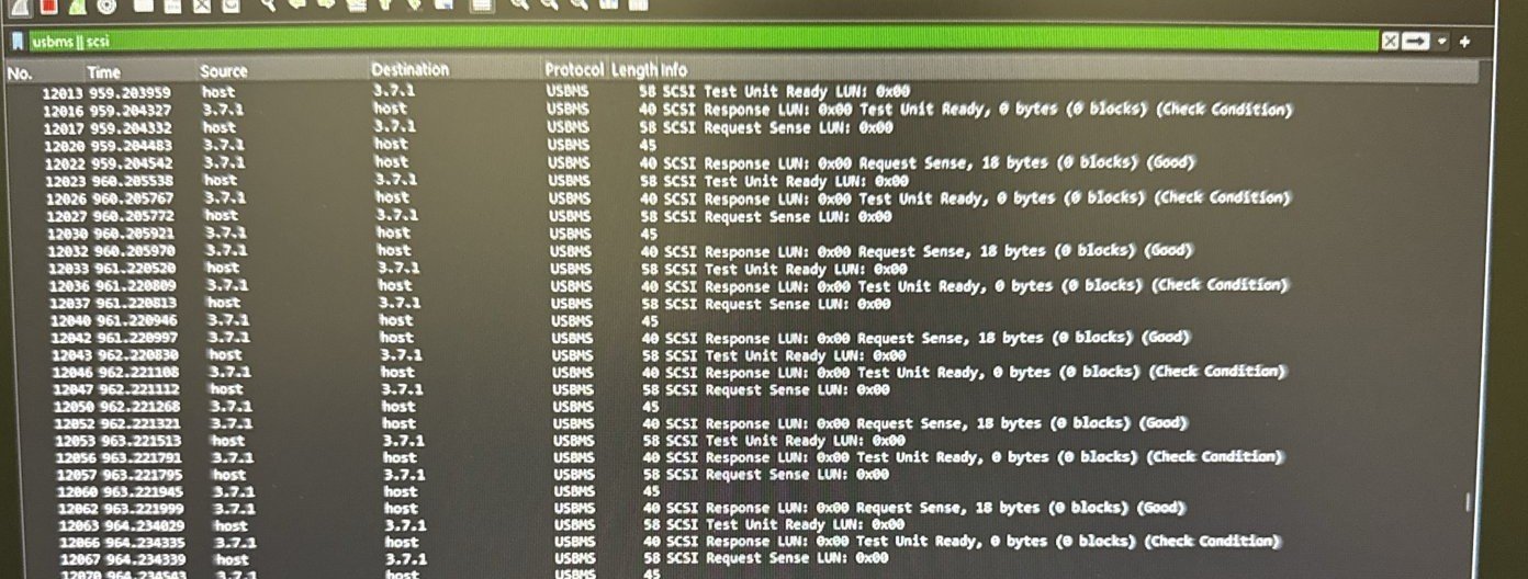 Wireshark packet list showing repeating Test Unit Ready and Request Sense packets